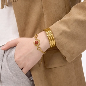 Elegant gold chain bracelet with red agate stone and layered textured cuff for women