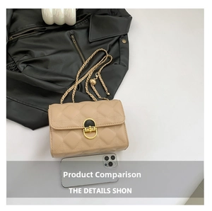 Detail of beige quilted flap bag with gold semi-circle lock and woven chain strap