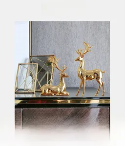 Close-up of golden electroplated deer ornaments in a modern minimalist home setting
