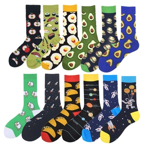 Flat lay of colorful crew socks featuring avocado, egg, and burger creative patterns
