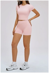 Pink short sleeve crop top and high waist compression shorts yoga set for women