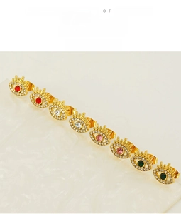 Detailed view of colorful evil eye zircon stud earrings with gold plating in rows