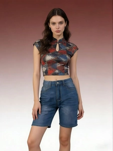 Slim fit red geometric crop top and classic blue denim shorts on a model