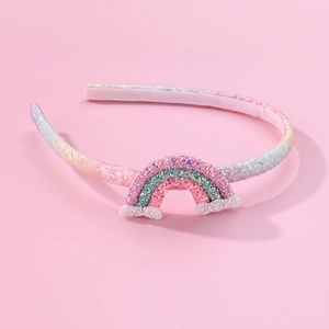 Sparkly glitter rainbow headband for girls with 3D cloud design on a pink background