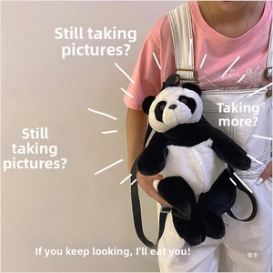 Detail of a plush panda backpack showing soft faux fur texture and adjustable straps