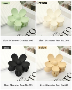 Detail showing matte flower hair claws in four colors with 7cm diameter measurement