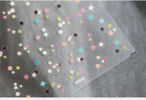 Macro detail of KX044 ultra-thin nail stickers with colorful geometric star and circle patterns
