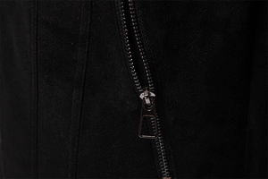 Close-up of a silver metal zipper on a premium black suede jacket with neat stitching