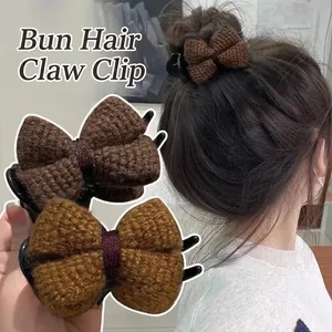 Knitted bow claw clip for bun hairstyles in brown and tan plush wool fabric texture