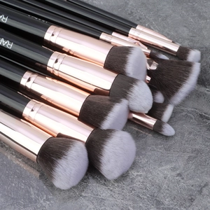 Macro detail of high-quality synthetic makeup brush bristles with rose gold metal ferrules