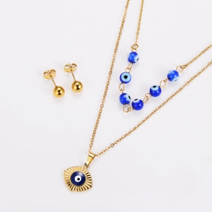 Double-layered gold necklace and stud earrings set with blue evil eye charms and beads