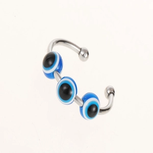 Close-up of adjustable Evil Eye rotating ring with blue beads on polished silver band