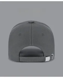 Detail view of cotton baseball cap back featuring an adjustable strap with metal buckle