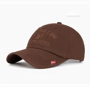 Detail of coffee brown cotton baseball cap with embroidered lettering and red label