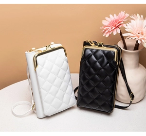 Detail of quilted crossbody phone bags in black and white with vintage gold clasps