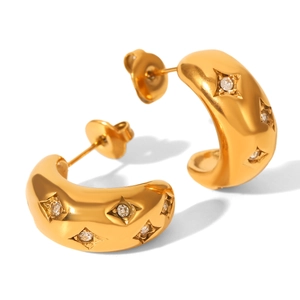 Close-up of C-shaped 18K gold earrings with star patterns and zircon stone details