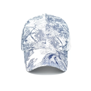 Classic baseball cap featuring blue and white Toile de Jouy floral print pattern