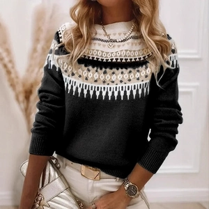 Detail of geometric jacquard pattern on black crewneck sweater with ribbed cuffs