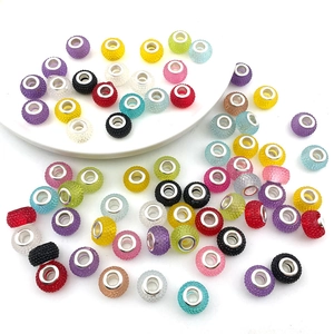 Close-up of colorful resin large hole beads with silver metal cores for DIY jewelry making