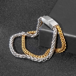 Close-up of two-tone gold and silver punk style braided stainless steel chain bracelet