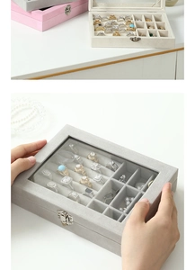 Macro view of velvet jewelry box with transparent glass window and metal buckle closure