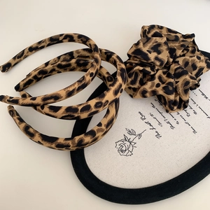 Retro leopard print hair accessory set with wide headband and soft fabric scrunchie