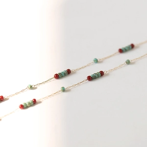 Vintage style gold chain necklace with turquoise glass and dark red beaded accents
