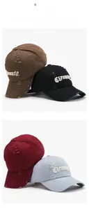 Detailed view of distressed baseball caps with 3D Chromatic embroidery in four colors