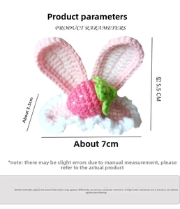 Detail showing dimensions of a handmade crochet rabbit ear hair clip with strawberry charm