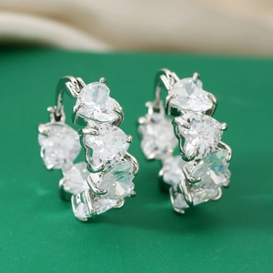 Silver heart-shaped zircon hoop earrings with premium claw setting and elegant metal finish