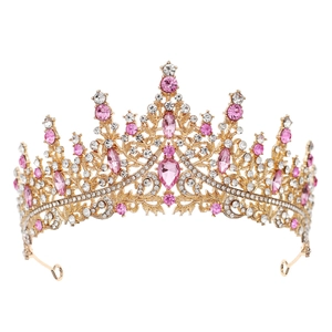 Detail showing pink and white teardrop crystals on a golden Baroque bridal crown