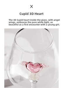 Macro shot of glass goblet featuring a 3D pink heart and wings cupid design inside