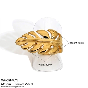 Golden monstera leaf stainless steel open ring with hollow design on white background