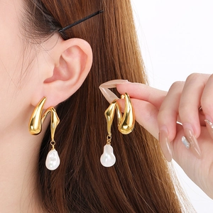 French style gold irregular earrings with baroque pearl tassels and minimalist metal design
