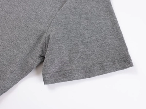 Macro detail of the sleeve stitching and knit texture on a grey V-neck slim-fit T-shirt