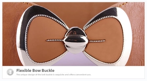 Detailed close-up of a silver bow buckle and stitching on a brown leather waist belt