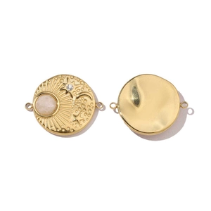 Detail of golden sun and moon pendants with inlaid opal stone and polished finish
