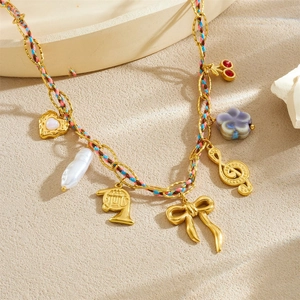 Gold chain necklace with colorful woven rope and heart musical note charms