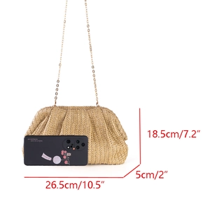 Detailed size comparison of straw clutch bag next to smartphone with measurements