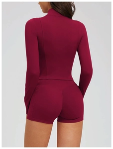 Detail view of burgundy yoga jacket back with slimming seams and high-stretch fabric