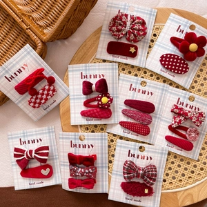Handmade red fabric bow hair clips set for girls featuring velvet and floral textures