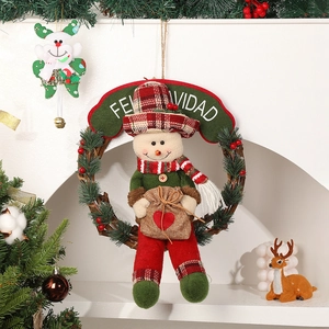 Christmas snowman wreath with rattan ring and Feliz Navidad sign for holiday door decoration