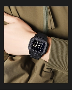 Close-up of black square digital sports watch with WR50M water resistance on wrist