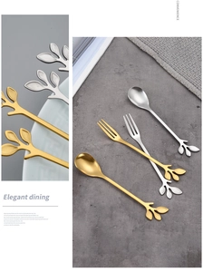 Detailed view of creative leaf-shaped handle on gold and silver stainless steel spoons