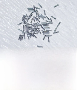 Macro detail of 1.2mm x 6mm silver titanium steel piercing rod pins for DIY jewelry