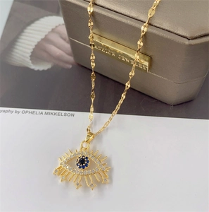 Golden titanium steel evil eye necklace with blue zircon and shimmering rhinestones