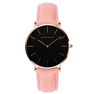 Minimalist quartz watch with pink leather strap and rose gold case on white background