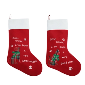 Set of 2 red Christmas stockings featuring cat and dog designs with plush white cuffs