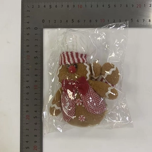 Detailed measurement of plush gingerbread man ornament with chef hat and bow tie