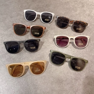 Flat lay of colorful foldable kids sunglasses featuring UV400 lenses and CE certification